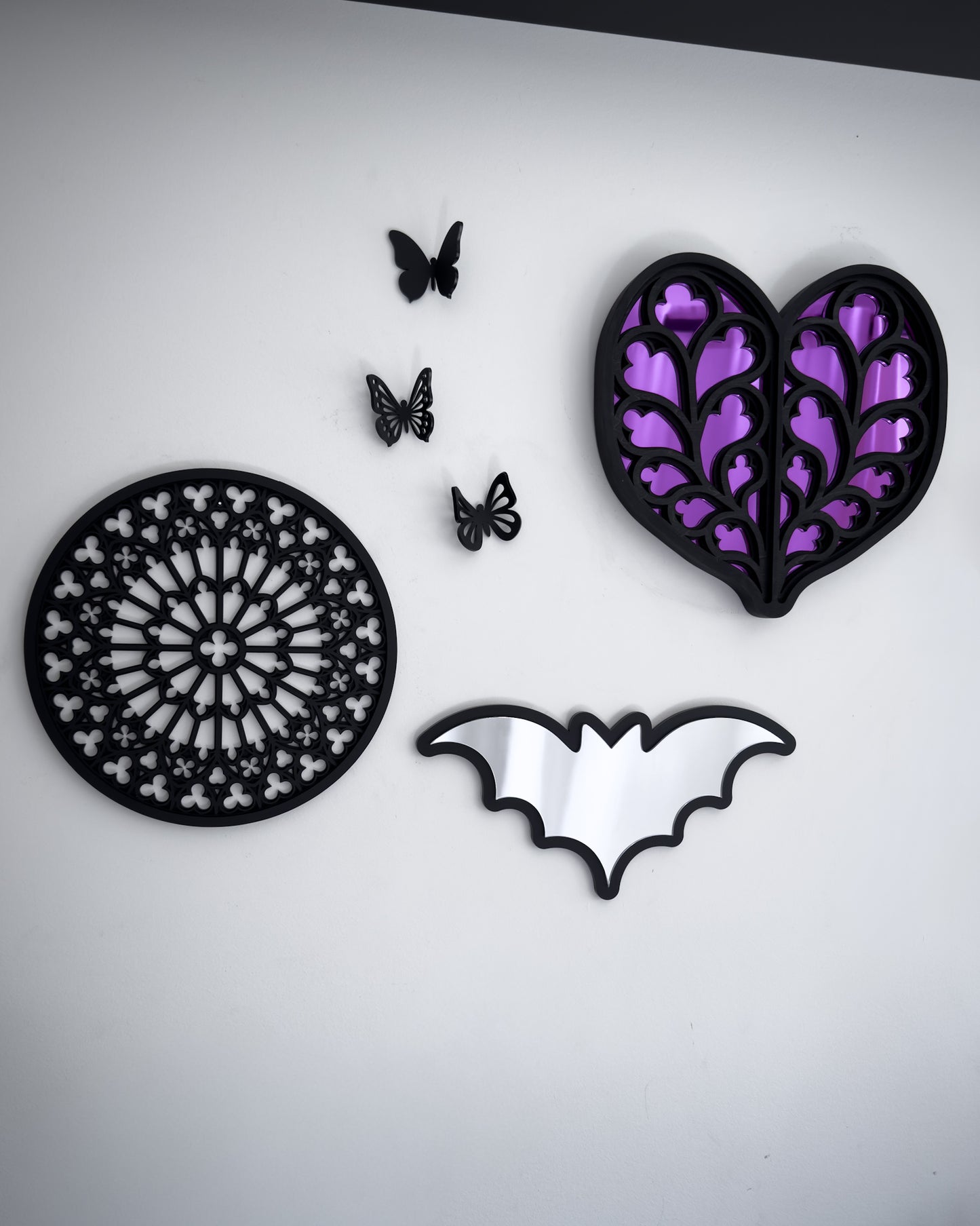 Gothic gallery wall with Heart of Yorkshire cathedral mirror, Notre Dame rose window wall art and bat mirror