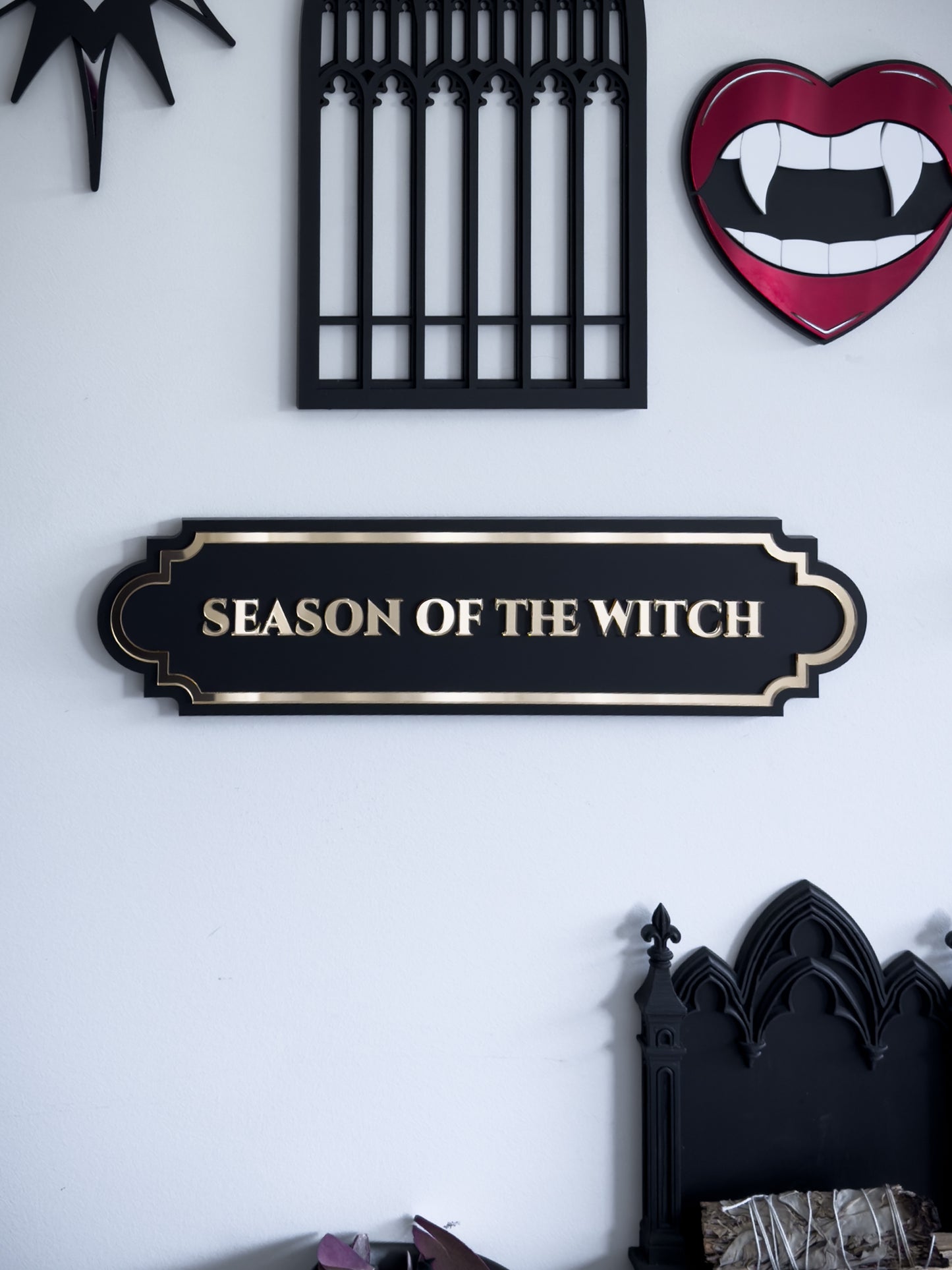Gothic wall art gallery with season of the witch plaque, vampire lips mirror and cathedral window acrylic decor