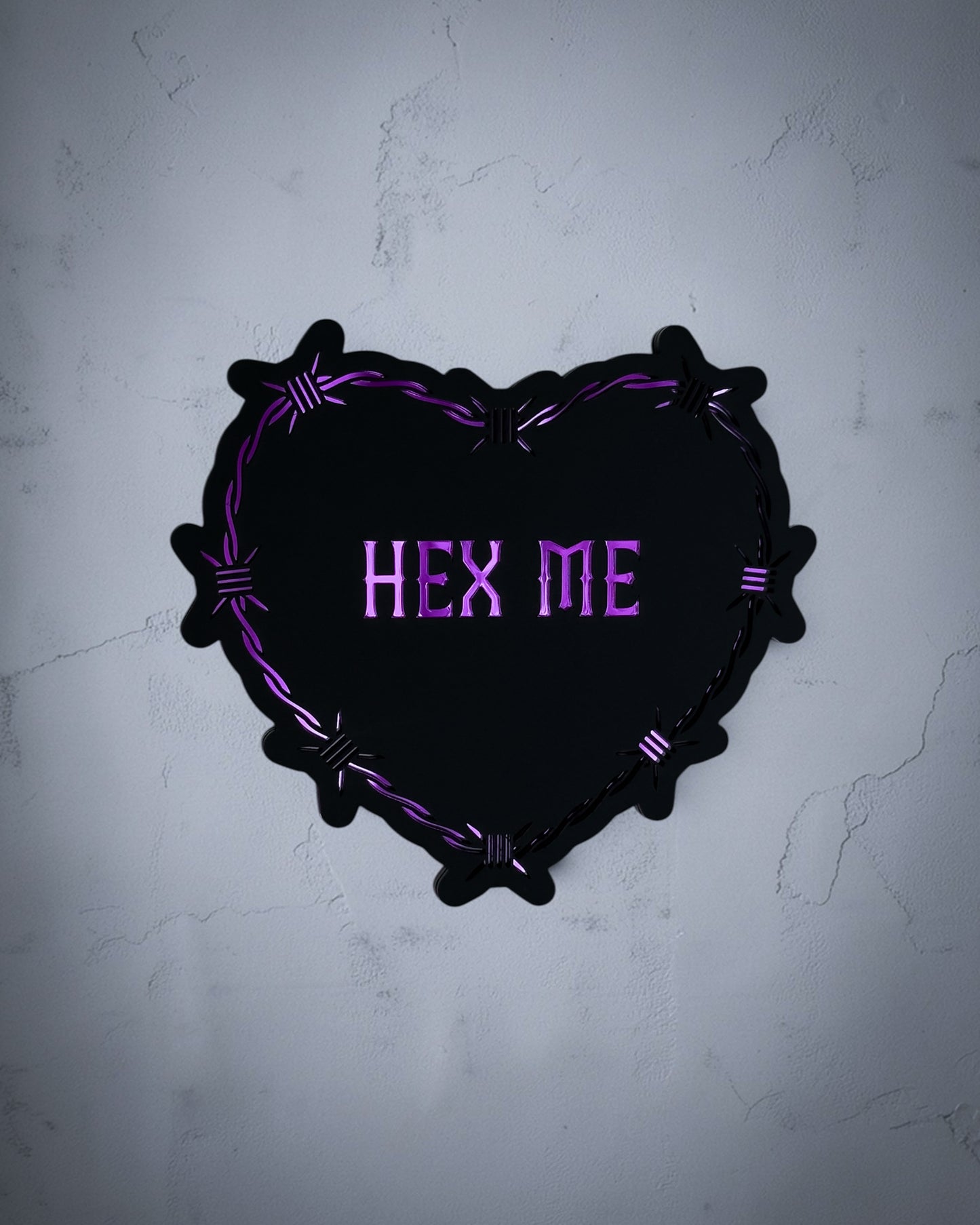Hex me gothic heart wall art with barbed wire design in purple on textured grey wall