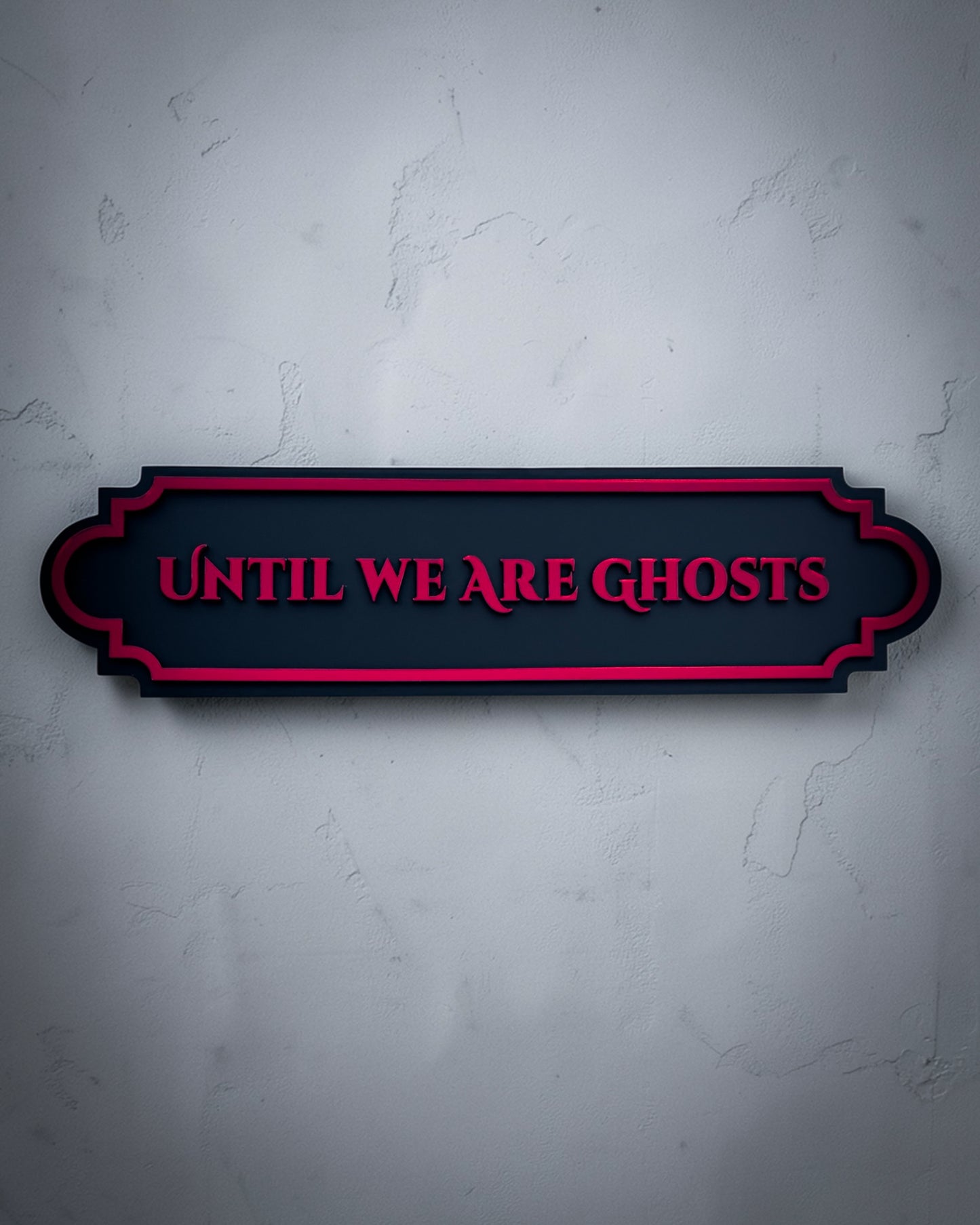 Until we are ghosts gothic wall art plaque in red mirror on textured grey wall