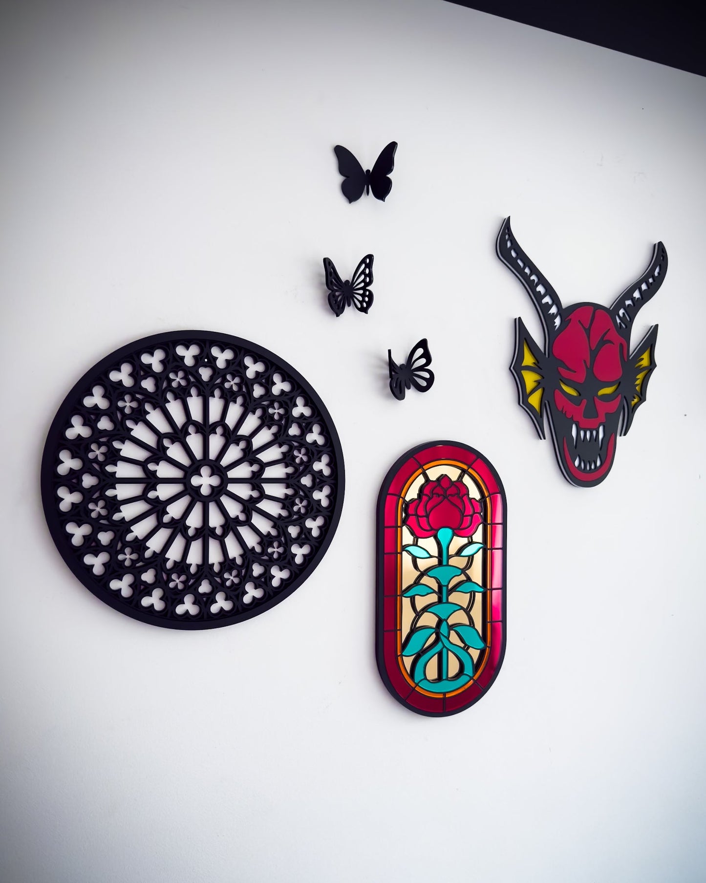 Gothic gallery wall with stained glass rose window mirror, Notre Dame tracery wall art and red hellfire demon wall art
