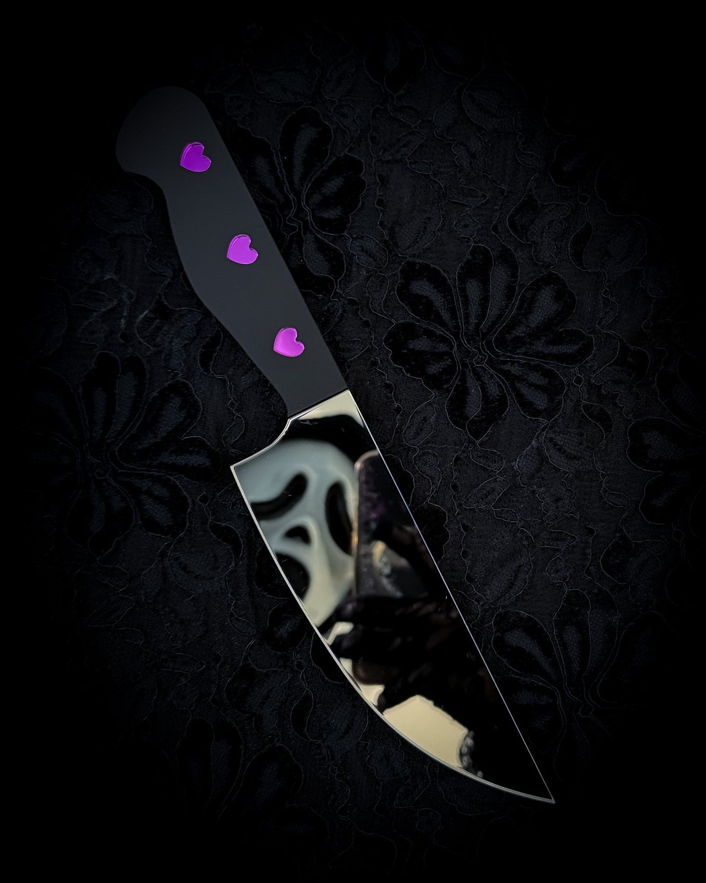 Heart handle knife mirror wall art with reflective blade on dark gothic background
