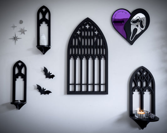 Gothic gallery wall ideas with cathedral mirrors, black wall shelves, bats, and dark romantic home decor styling