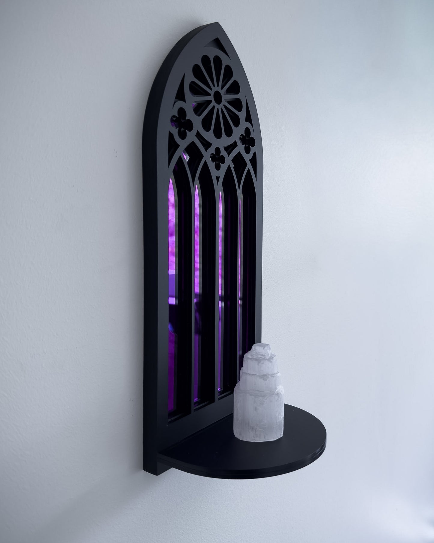 Side view of rose window wall shelf in black layered acrylic with purple mirror backing and crystal display 