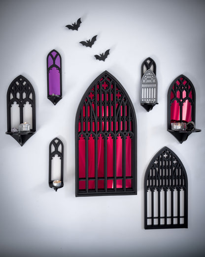 Gallery wall featuring gothic cathedral mirrors and shelves in black layered wood and acrylic with red and purple mirror