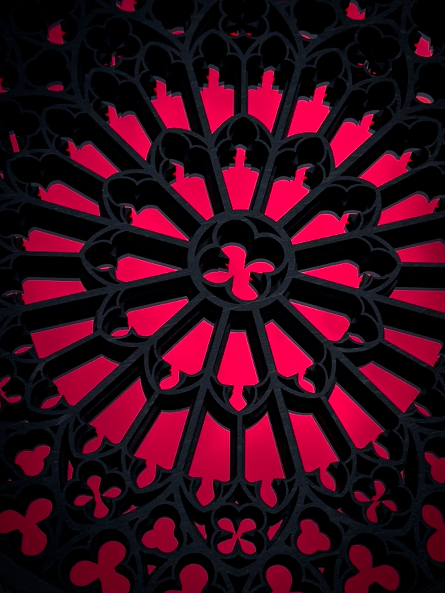 Red Notre Dame inspired gothic rose window wall art with detailed cathedral tracery