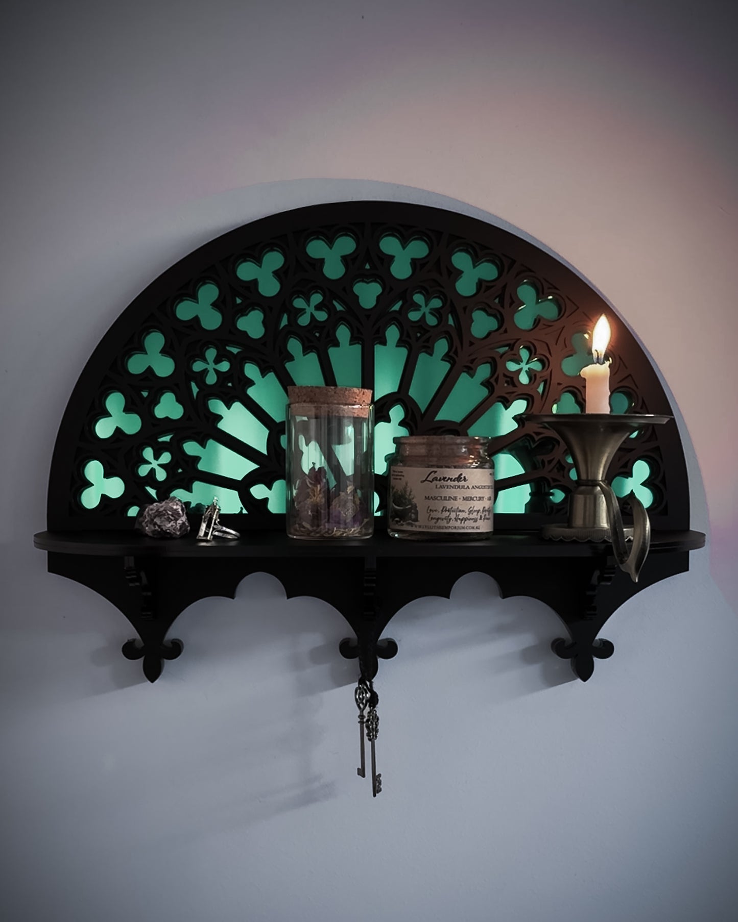 Notre Dame inspired gothic wall shelf styled with candle and mirror centre on wall