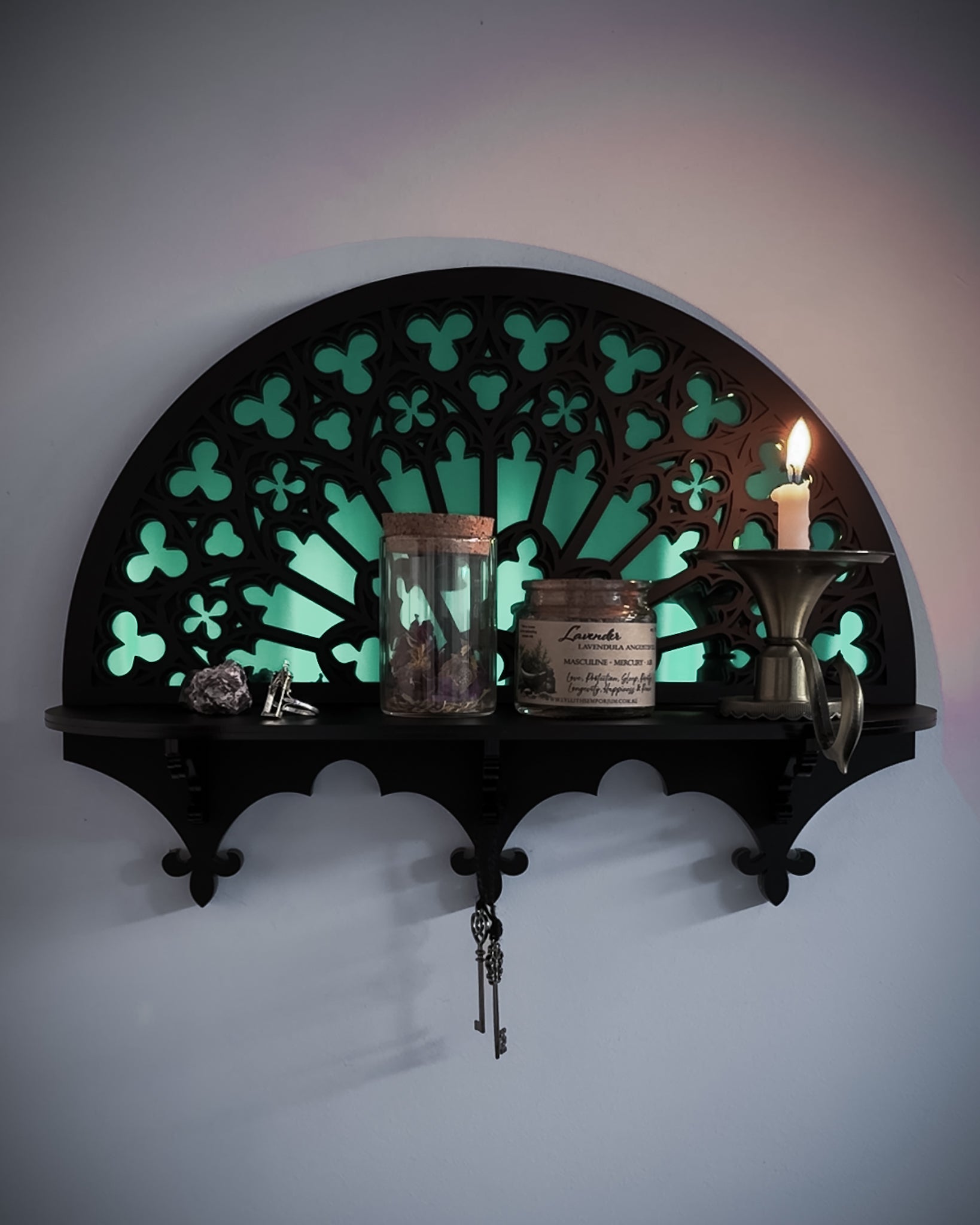 Notre Dame inspired gothic wall shelf styled with candle and mirror centre on wall