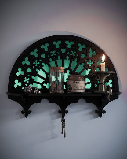Notre Dame inspired gothic wall shelf styled with candle and mirror centre on wall