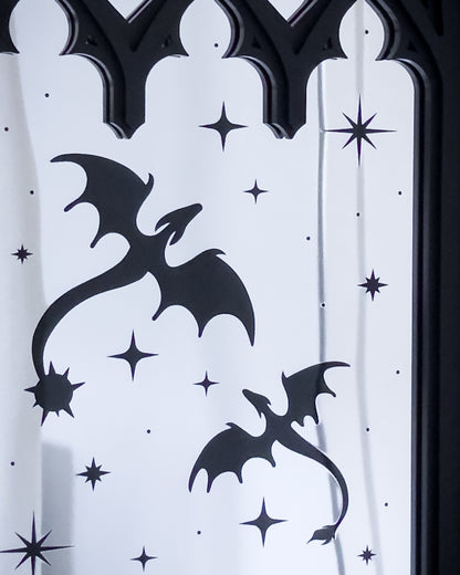 Close up of gothic cathedral mirror with dragon silhouettes and star details