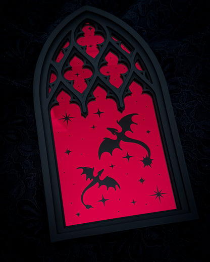 Gothic cathedral window mirror in red acrylic with dragon silhouettes on dark background
