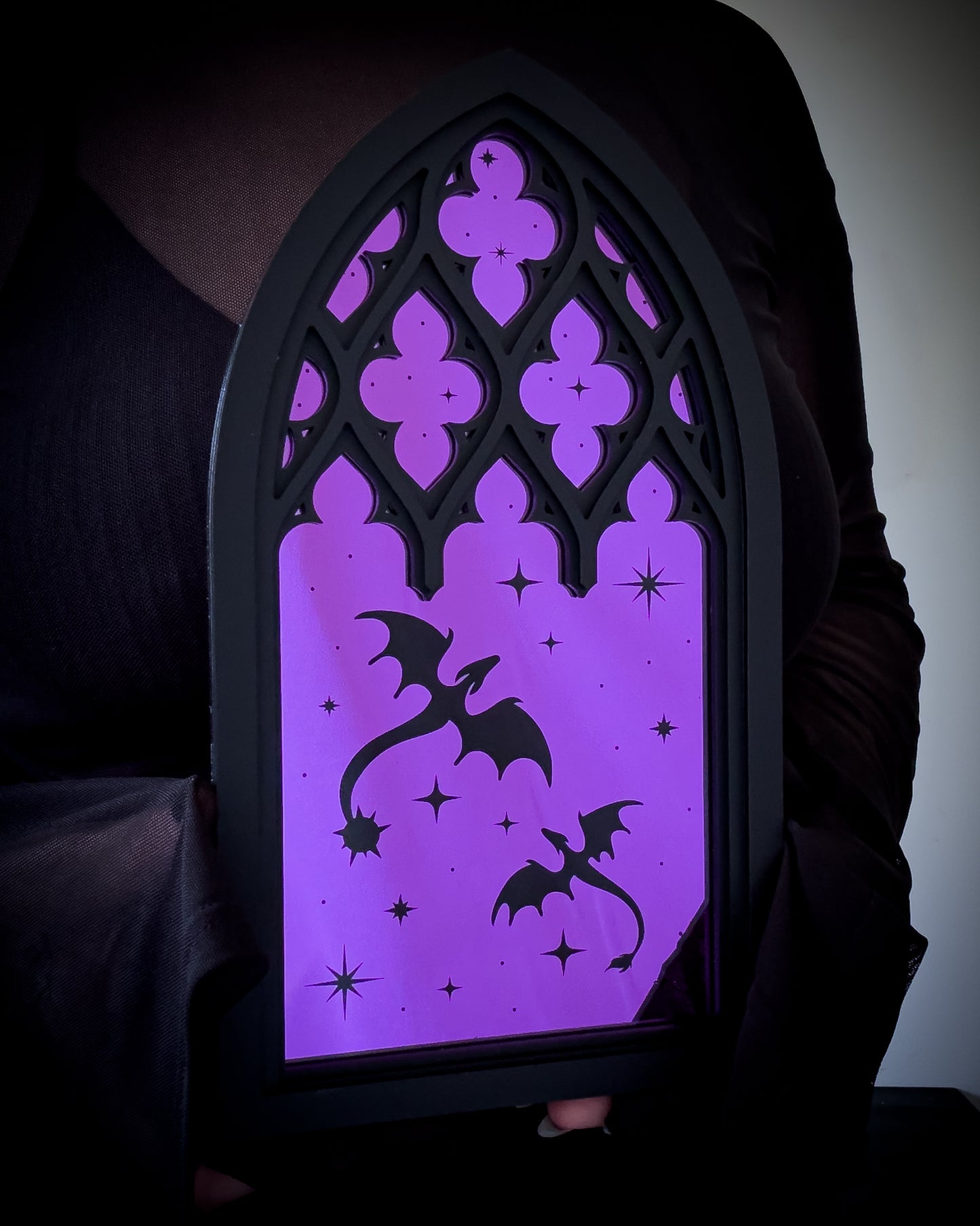 Gothic cathedral dragon window mirror with purple acrylic held for scale reference
