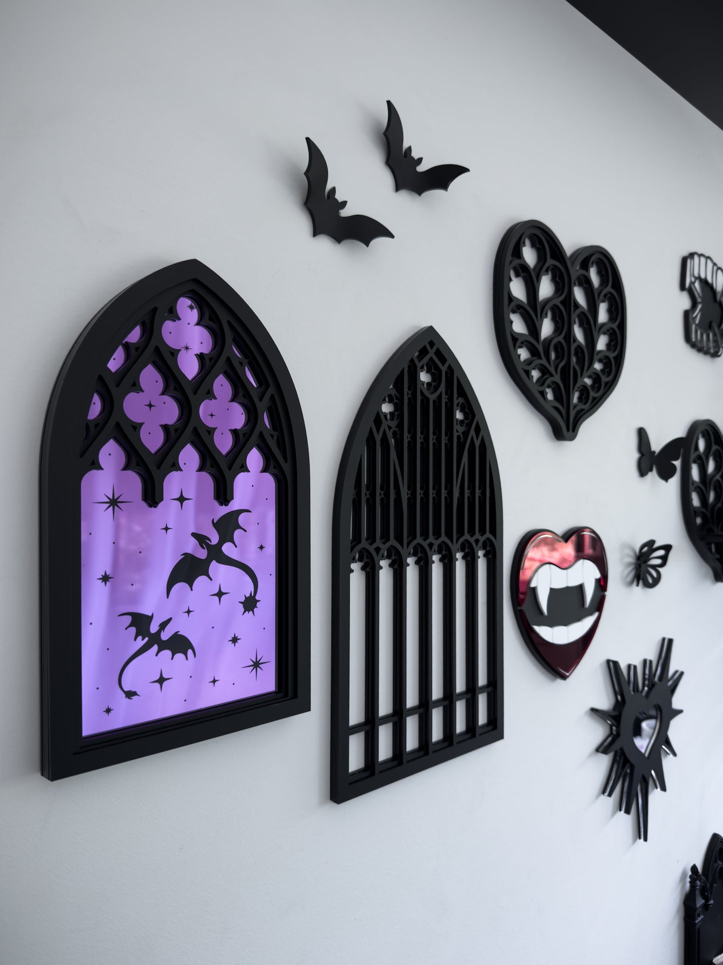 Gothic gallery wall with cathedral mirror, tracery window and decorative bats