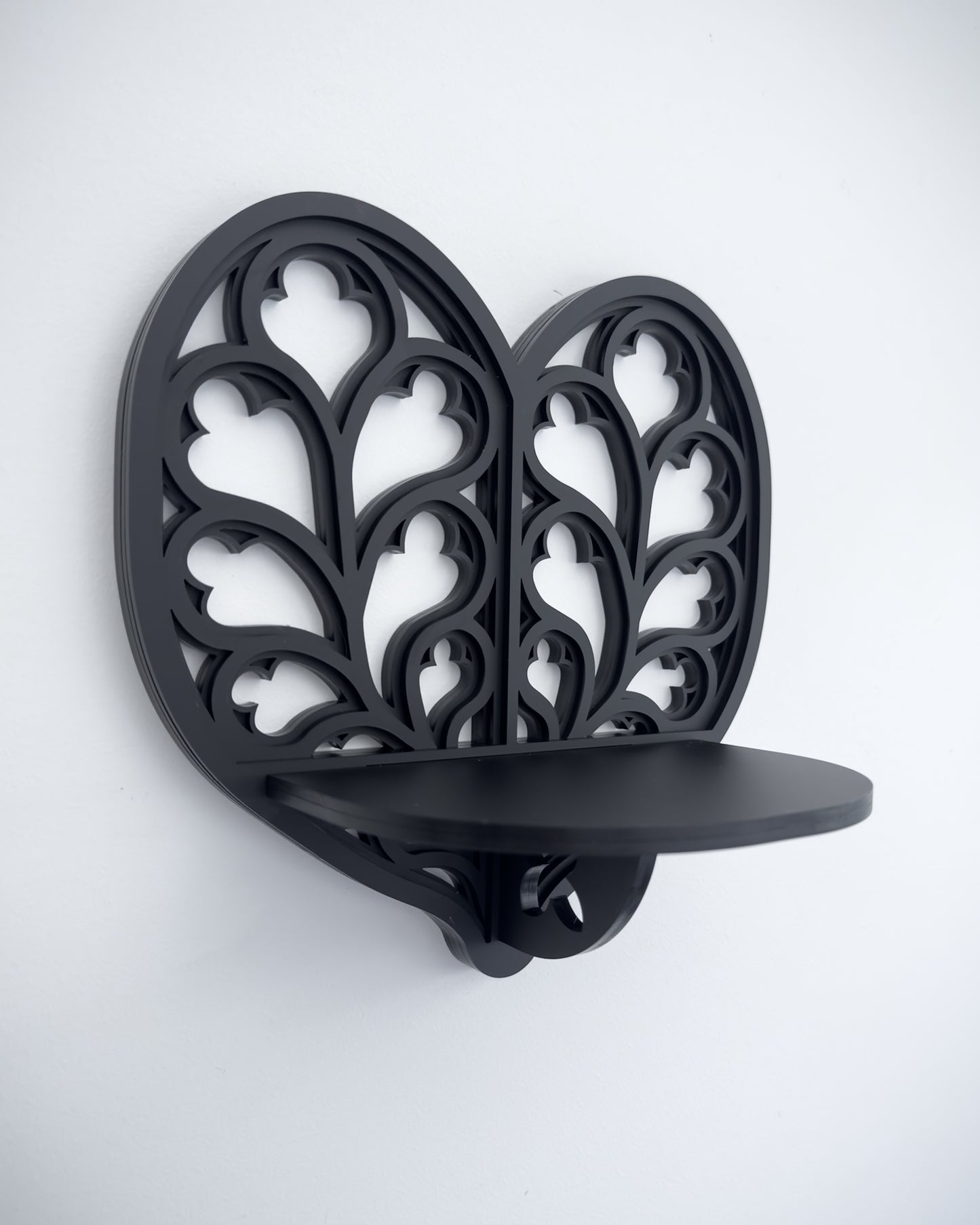 Close-up of Heart of Yorkshire cathedral tracery wall shelf in black layered acrylic
