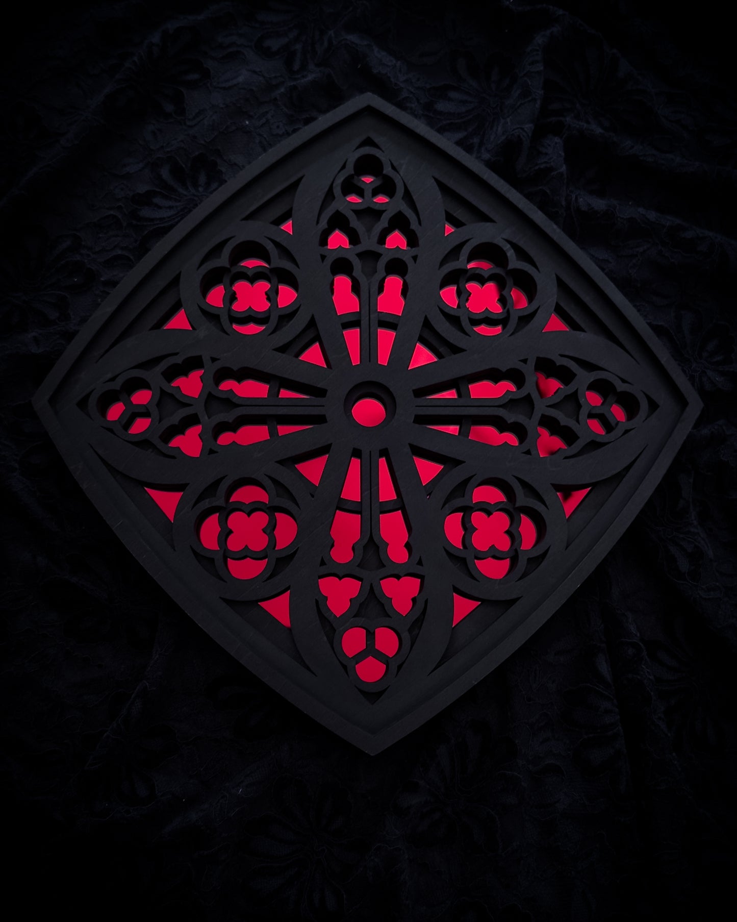 Cologne Cathedral window in black layered wood with red acrylic mirror centre