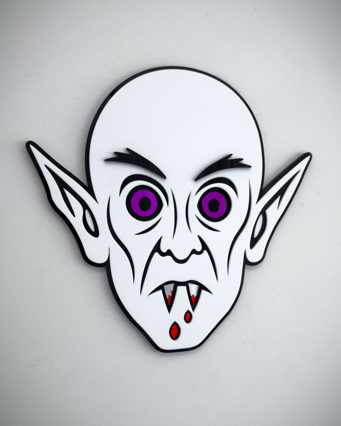 Nosferatu vampire face wall art in black and white acrylic with mirror purple eyes and blood detail