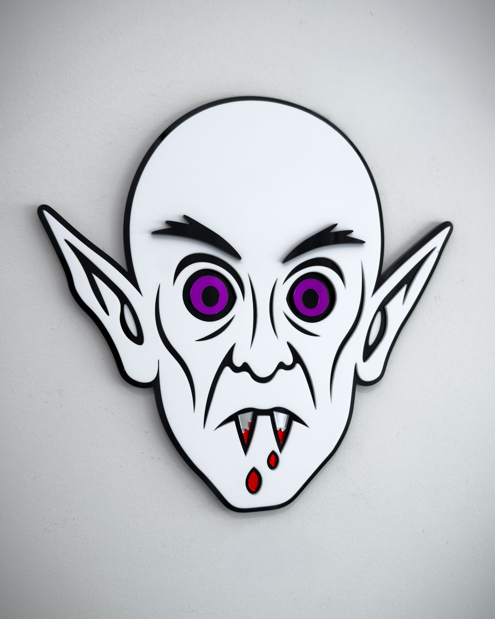 Nosferatu vampire face wall art in black and white acrylic with mirror purple eyes and blood detail