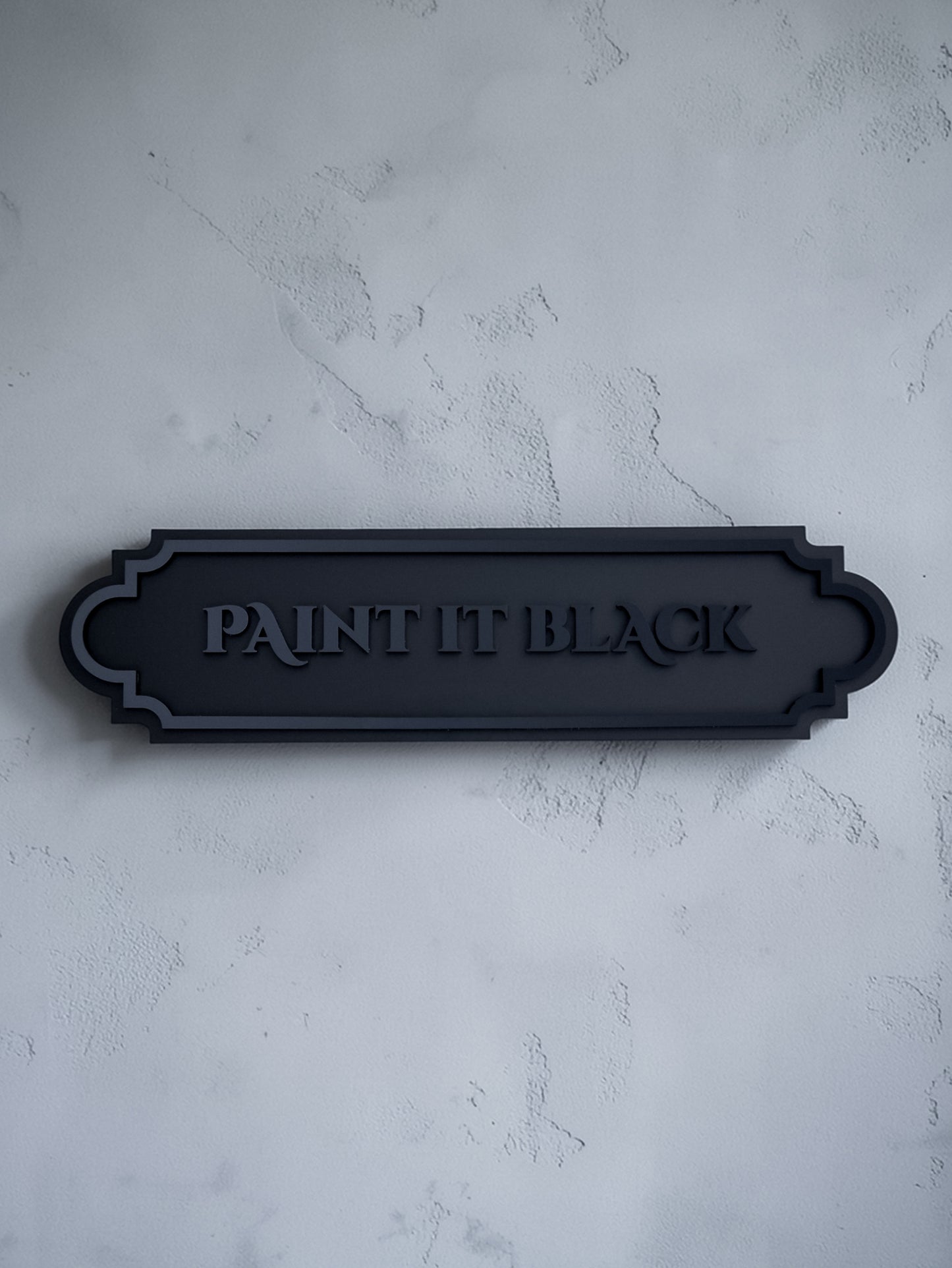 Paint it black gothic wall art plaque on textured grey wall