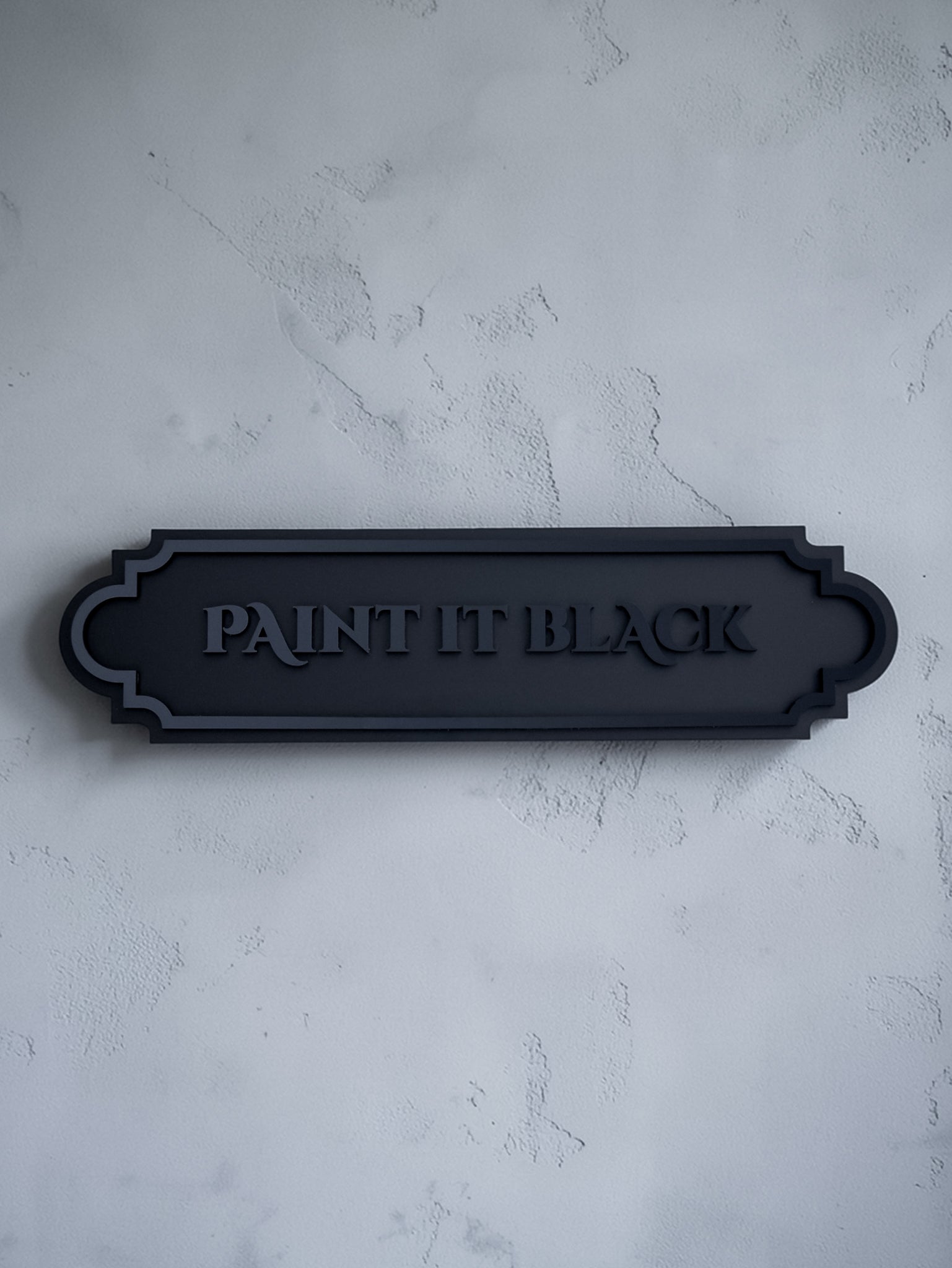 Paint it black gothic wall art plaque on textured grey wall