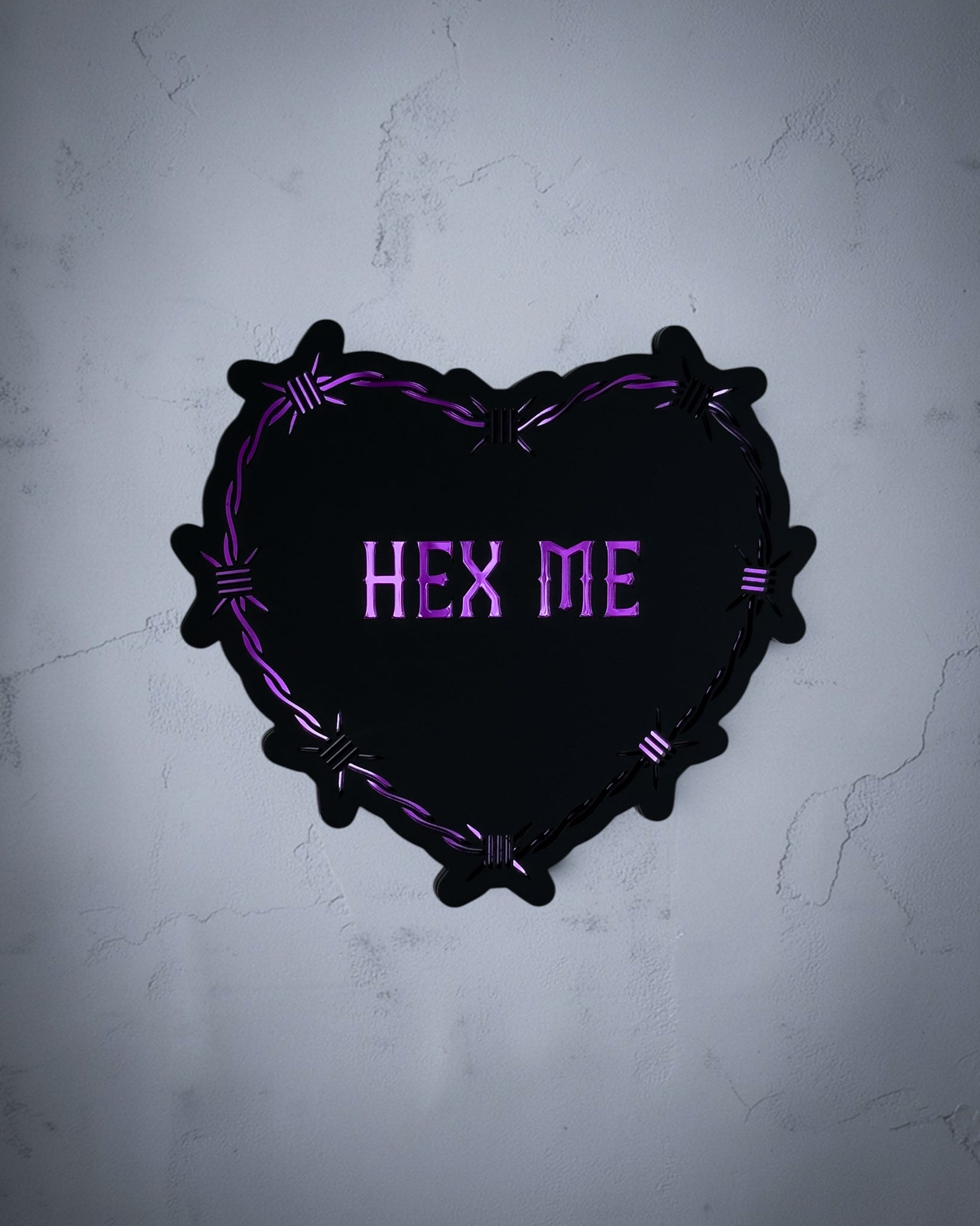 Hex me gothic heart wall art with barbed wire design in purple on textured grey wall
