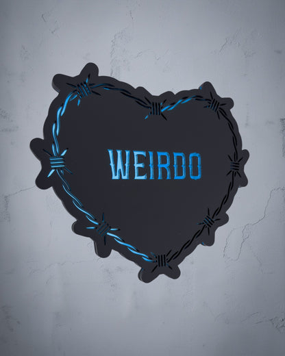 Weirdo gothic heart wall art with barbed wire design in blue and black acrylic on textured grey wall