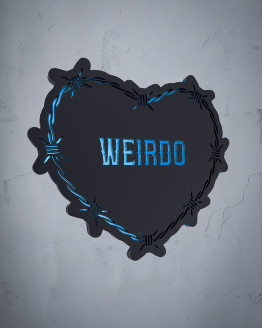 Weirdo gothic heart wall art with barbed wire design in blue and black acrylic on textured grey wall
