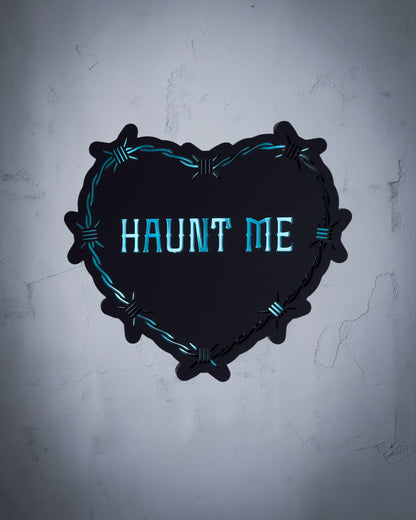 Haunt Me gothic heart wall art with barbed wire design in teal and black acrylic on textured grey wall