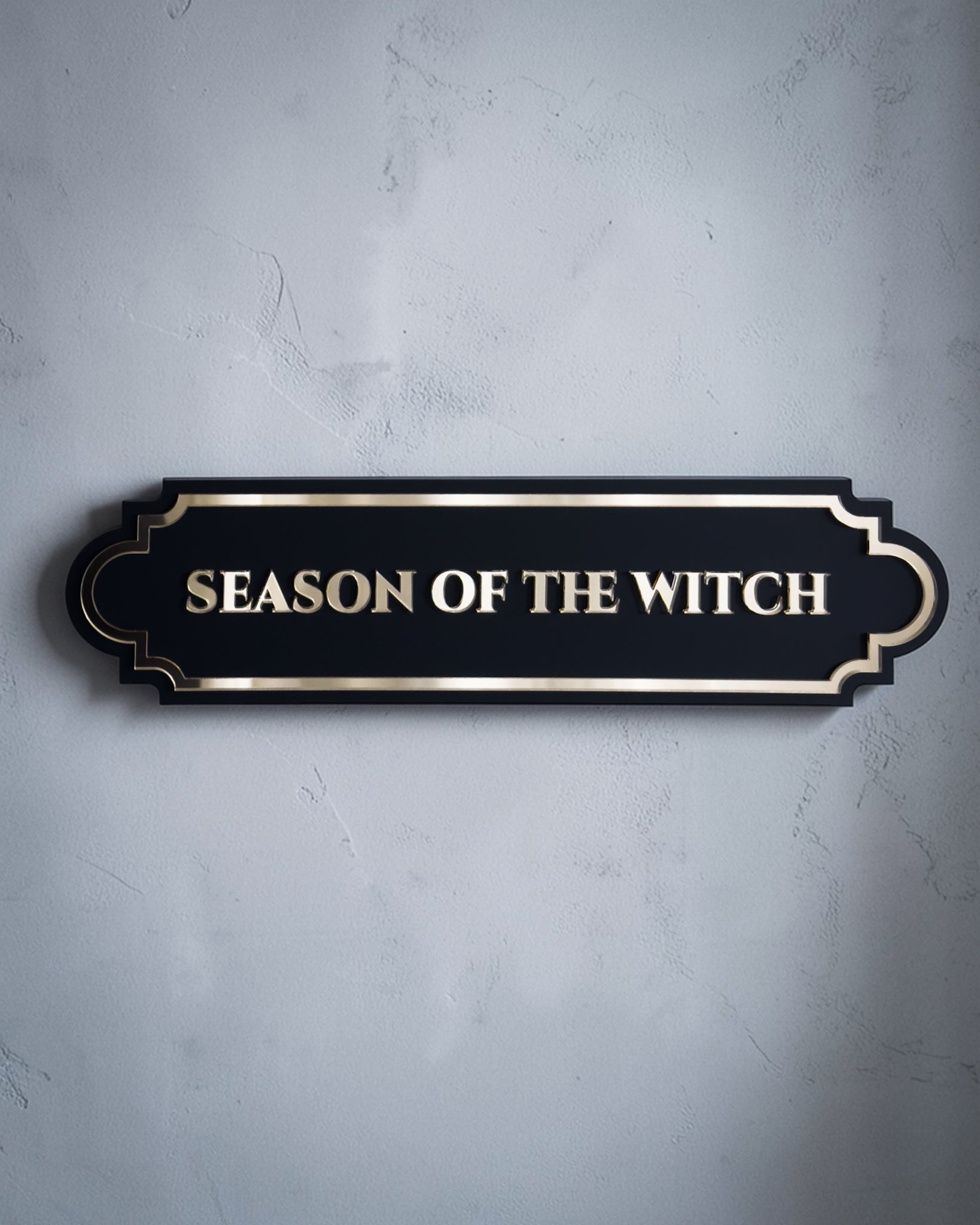 Black and Gold mirror Season of the witch gothic wall art plaque on textured grey wall