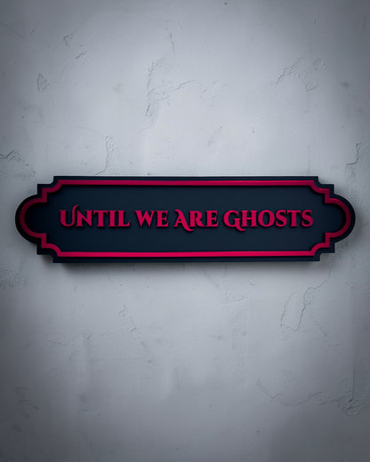 Until we are ghosts gothic wall art plaque in red mirror on textured grey wall
