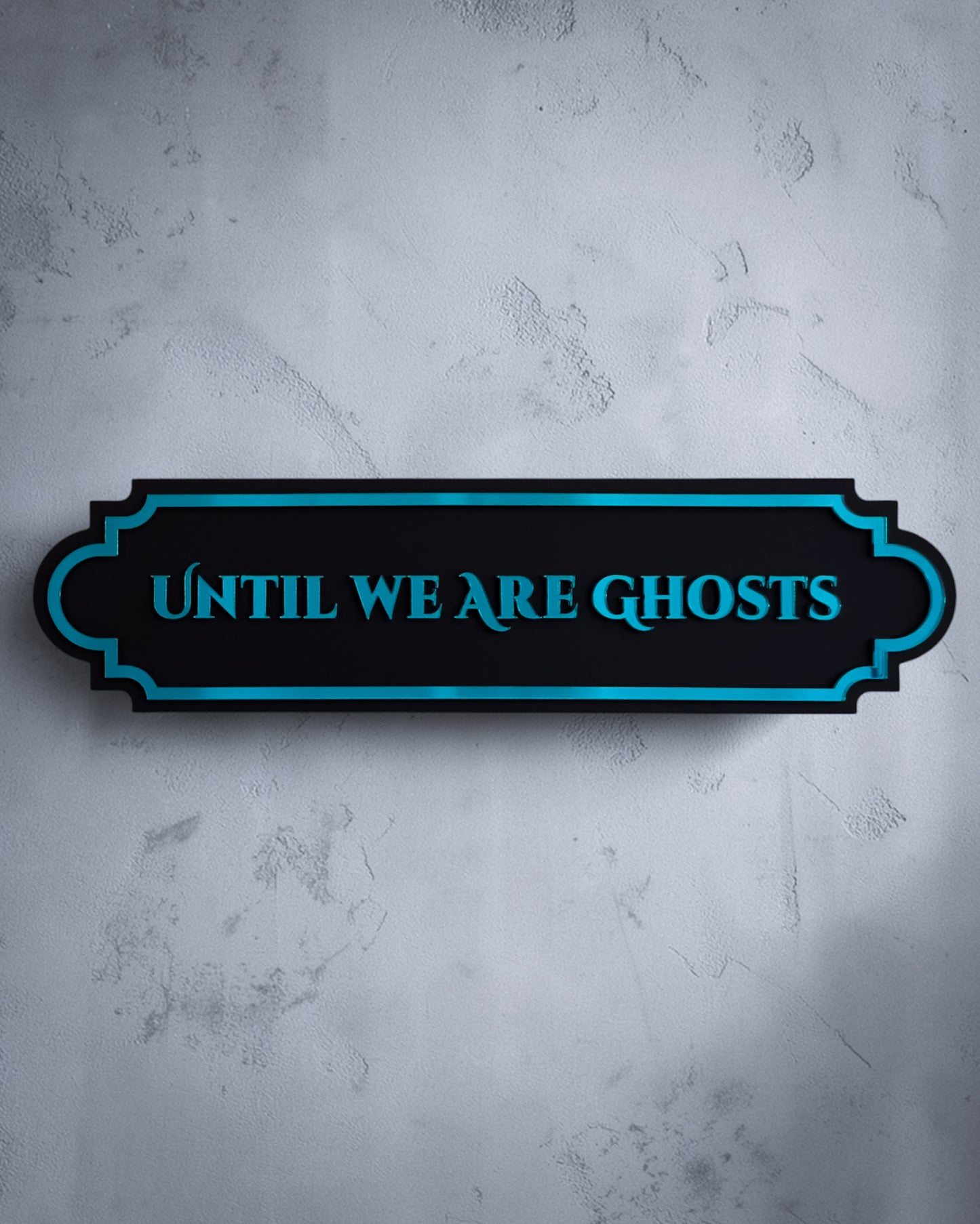 Until we are ghosts gothic wall art plaque in teal mirror on textured grey wall