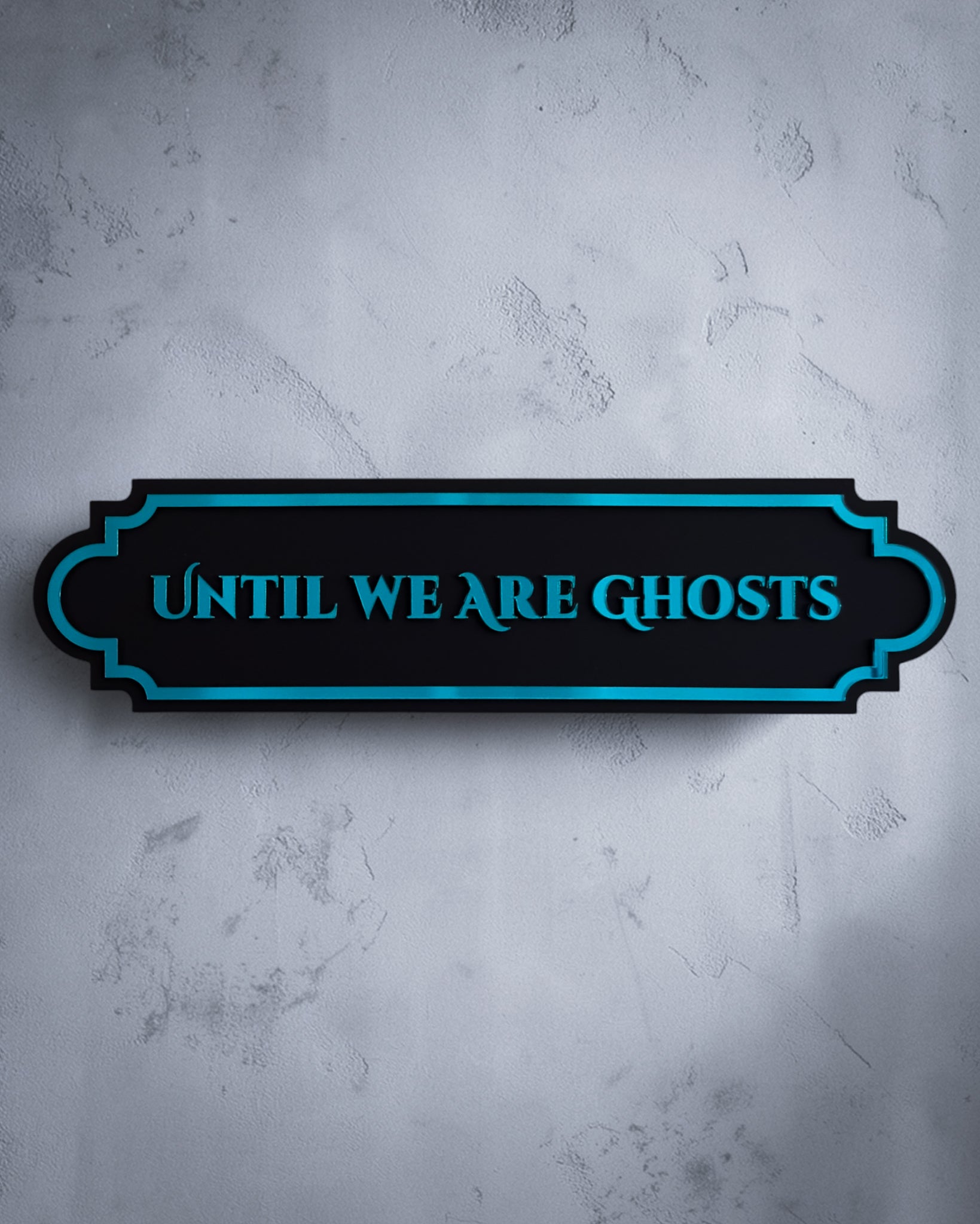 Until we are ghosts gothic wall art plaque in teal mirror on textured grey wall