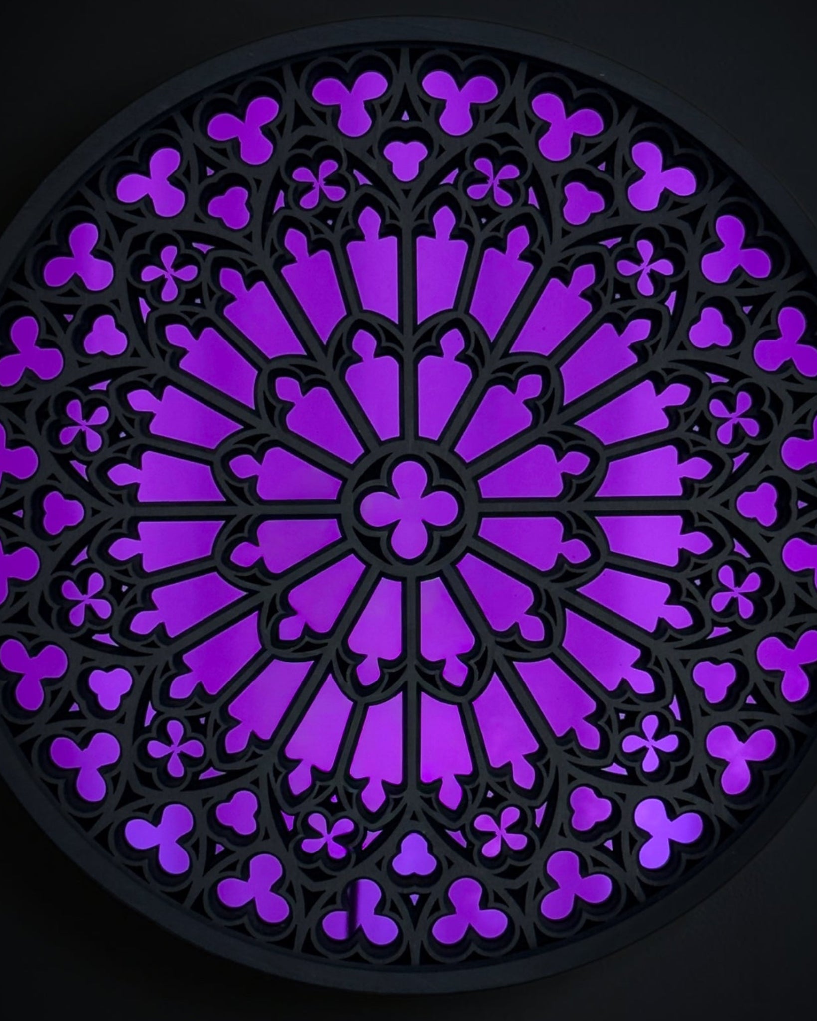 Red Notre Dame inspired gothic rose window wall art with detailed cathedral tracery