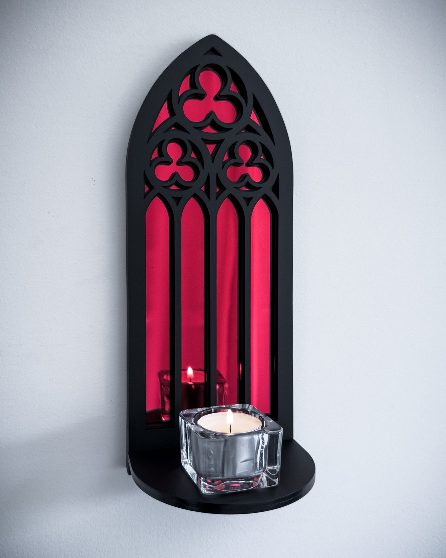 Gothic cathedral wall shelf in black layered acrylic with red mirror inset and candle display
