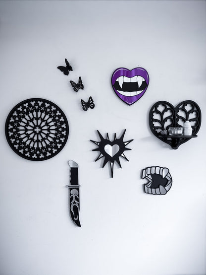 Gothic gallery wall featuring Notre Dame tracery wall art, Heart of Yorkshire tracery shelf, vampire lips mirror, silver barbed heart and knife wall decor