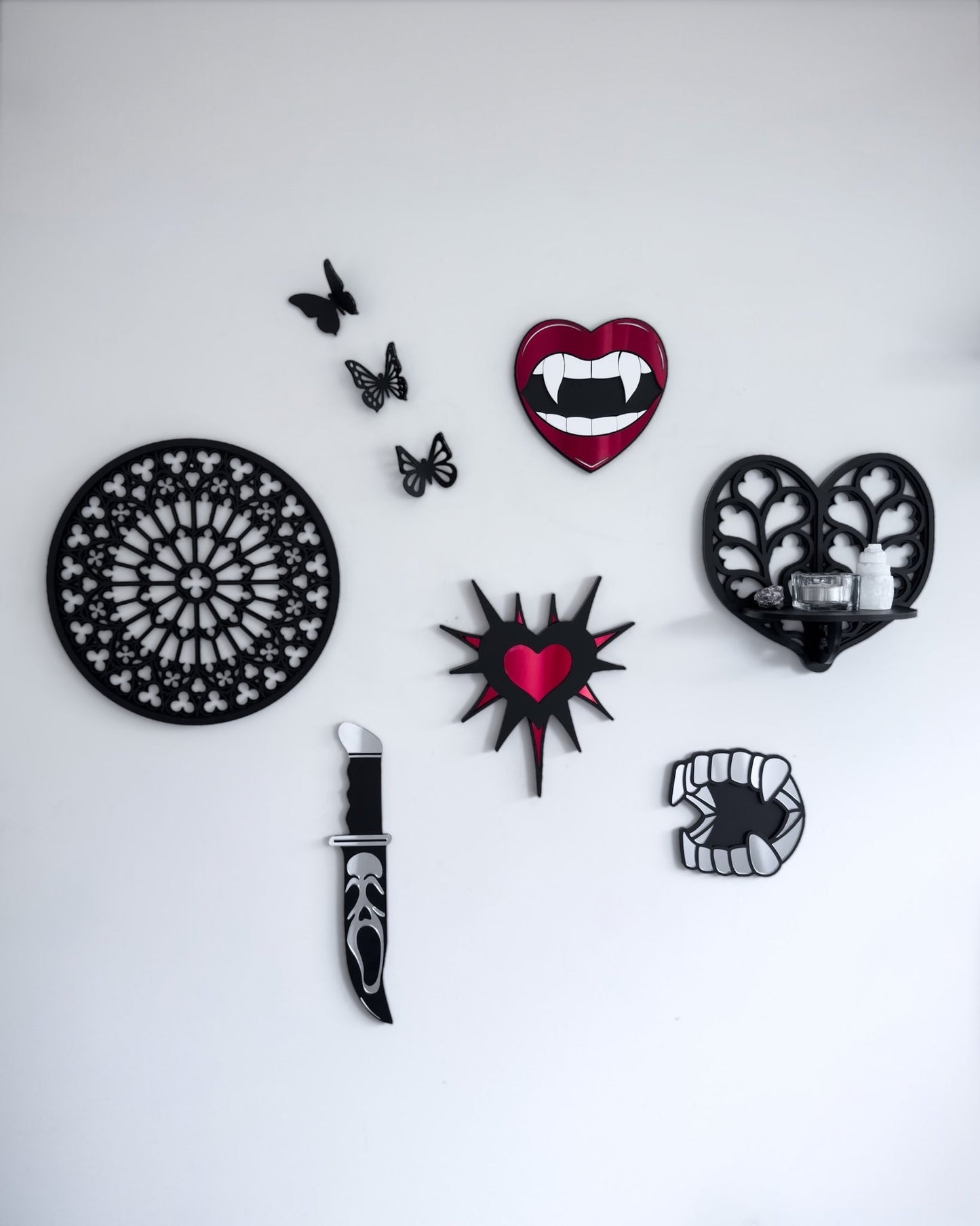Gothic gallery wall featuring Notre Dame tracery wall art, Heart of Yorkshire tracery shelf, vampire lips mirror and knife wall decor