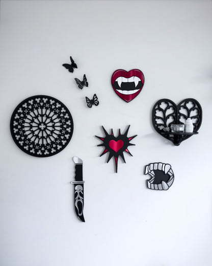 Gothic gallery wall featuring Notre Dame tracery wall art, Heart of Yorkshire tracery shelf, vampire lips mirror and knife wall decor