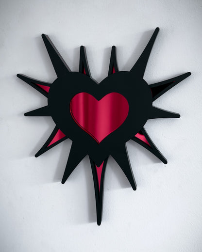 Gothic spiked barb heart mirror in black acrylic with red mirrored centre, wall mounted