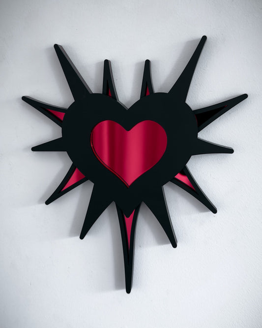 Gothic spiked barb heart mirror in black acrylic with red mirrored centre, wall mounted