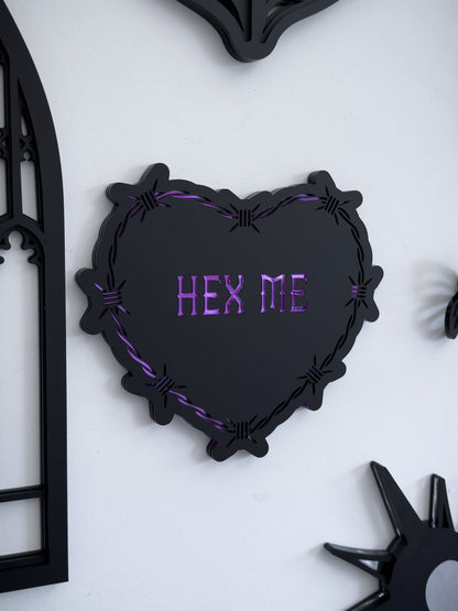 Gothic barbed wire heart wall art with “Hex Me” text, styled in a gothic gallery wall