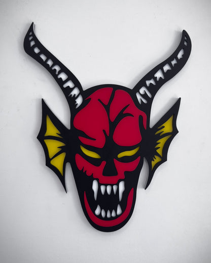 Hellfire demon acrylic wall art in red, black and yellow with horns and fangs