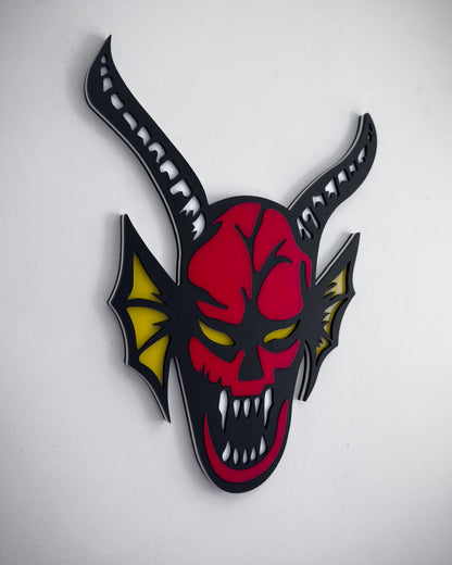 Side view of hellfire demon acrylic wall art in red, black and yellow with horns and fangs