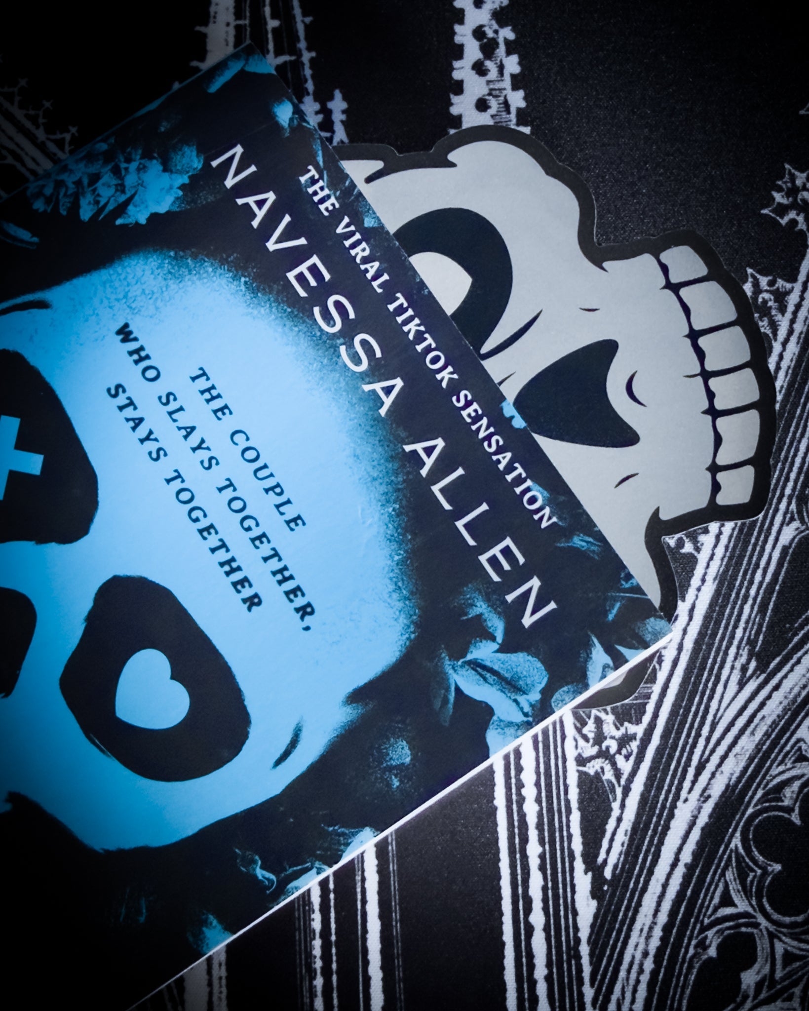 Gothic skull bookmark in black and silver leatherette, tucked in book