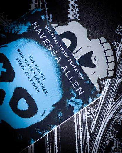 Gothic skull bookmark in black and silver leatherette, tucked in book