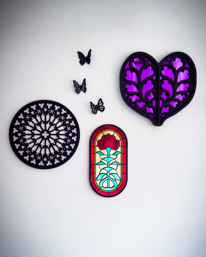 Gothic gallery wall with Notre Dame rose window tracery, small stained glass style rose window mirror and purple heart of Yorkshire wall art