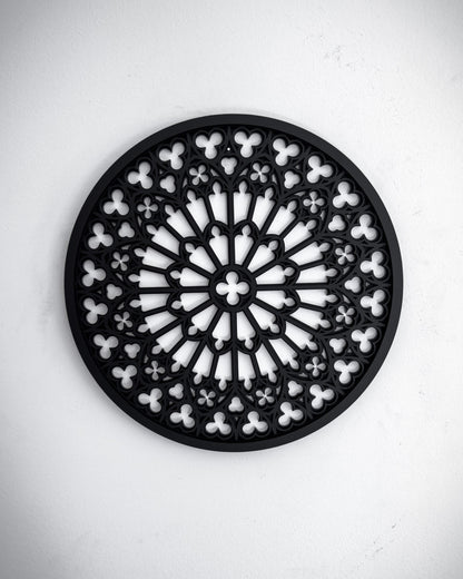 Notre Dame cathedral rose window tracery wall art in black layered acrylic on a white wall
