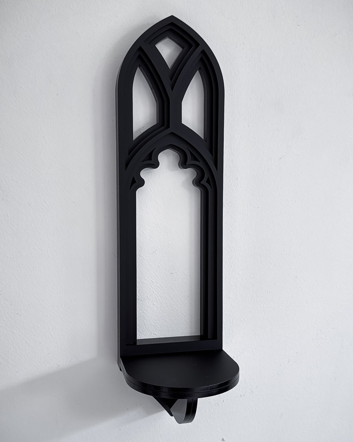 Close-up of mini Salem gothic tracery cathedral wall shelf in black layered acrylic