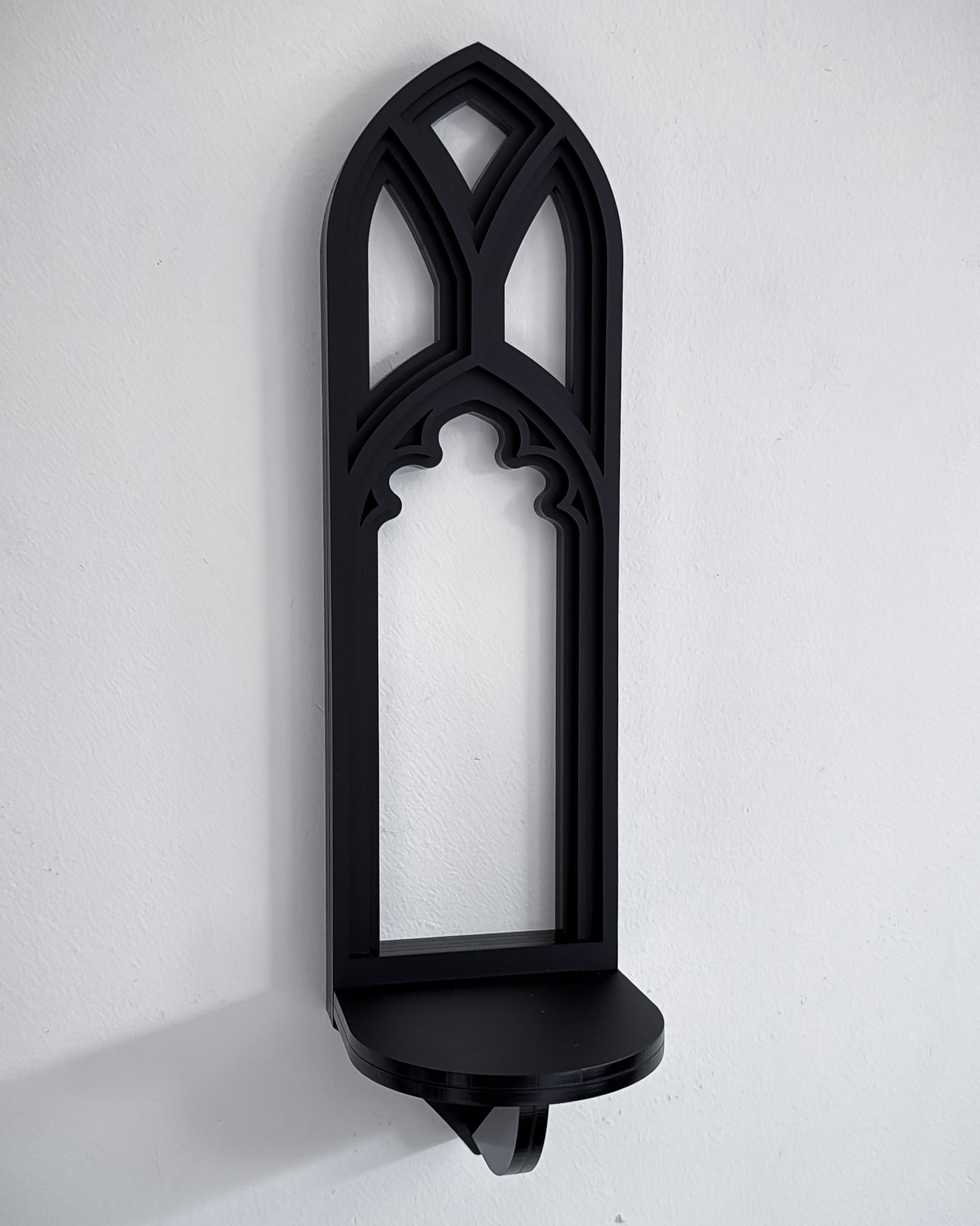 Close-up of mini Salem gothic tracery cathedral wall shelf in black layered acrylic