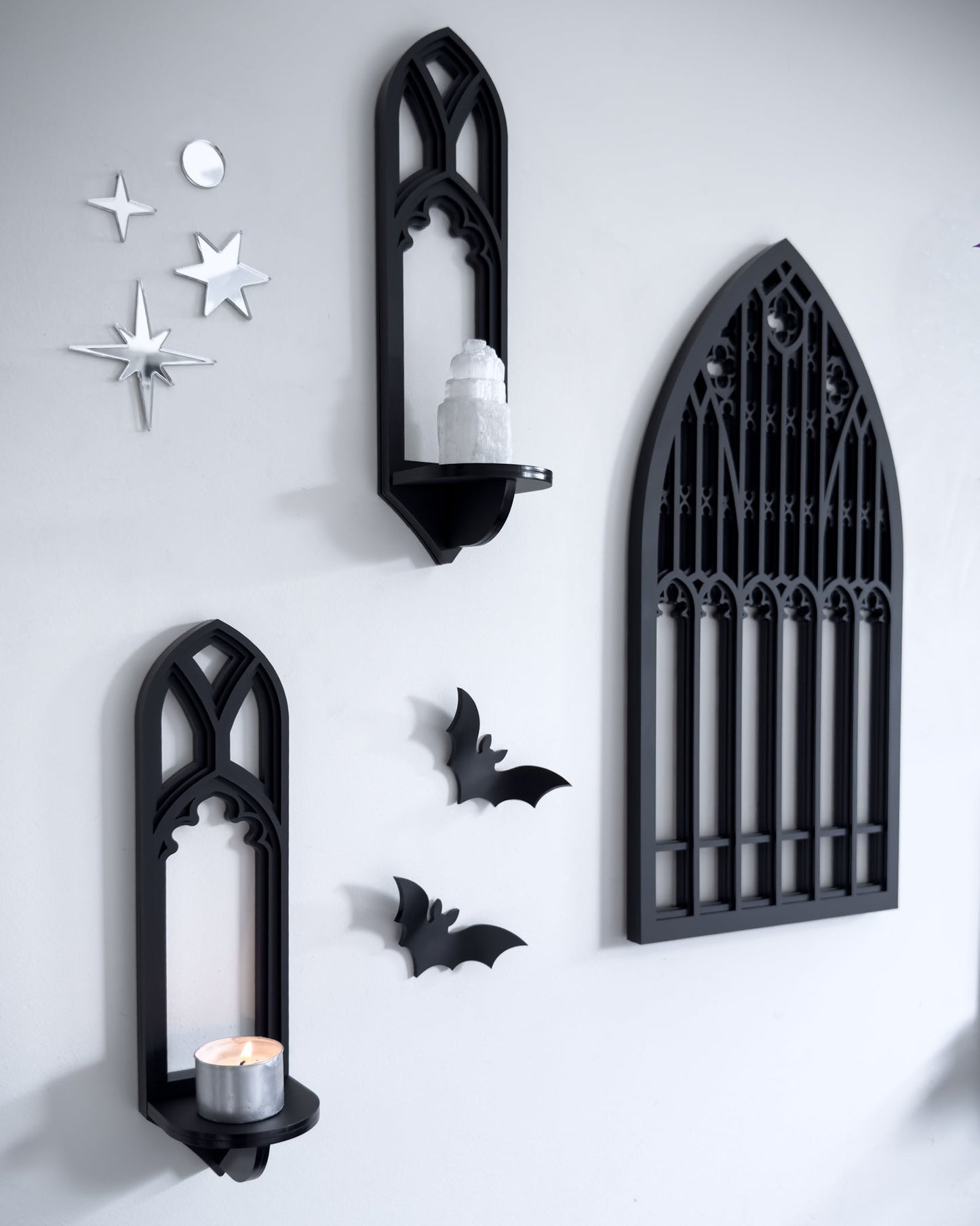 Close-up of Salem gothic tracery wall shelves and cathedral window wall art in black layered acrylic