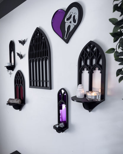 Side view of gallery wall featuring Salem gothic tracery wall shelves with acrylic bats and Ghostface mirror on a white wall