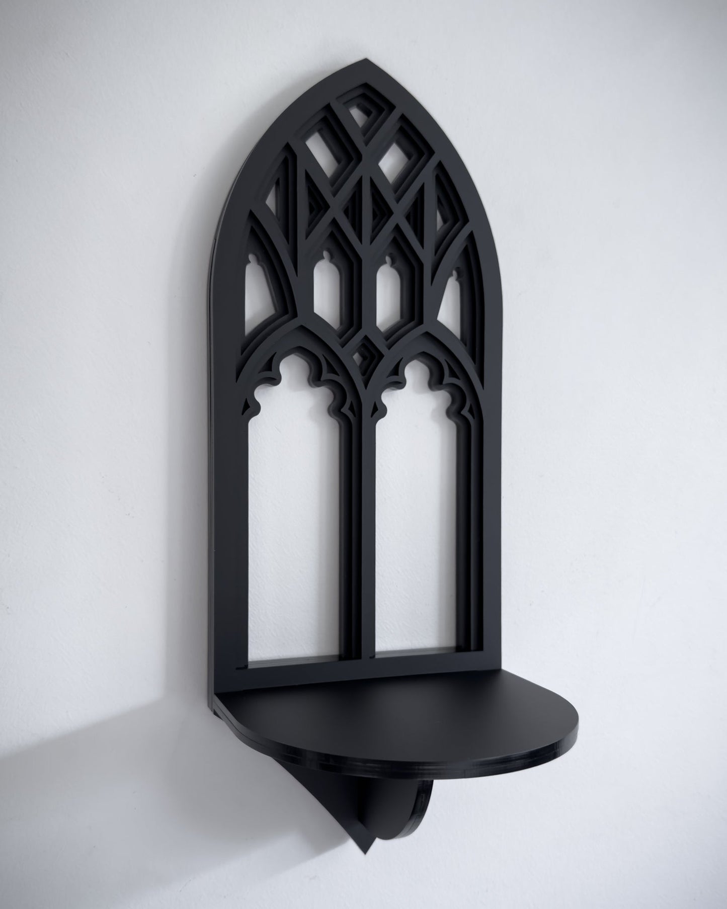 Close-up of Salem gothic tracery cathedral wall shelf in black layered acrylic